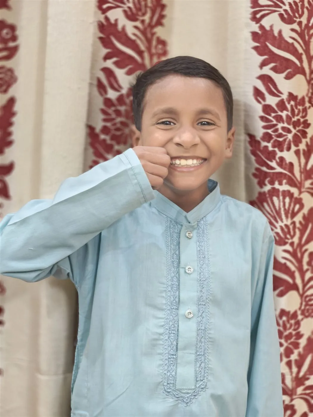A smiling boy at the Aasra Children's Home