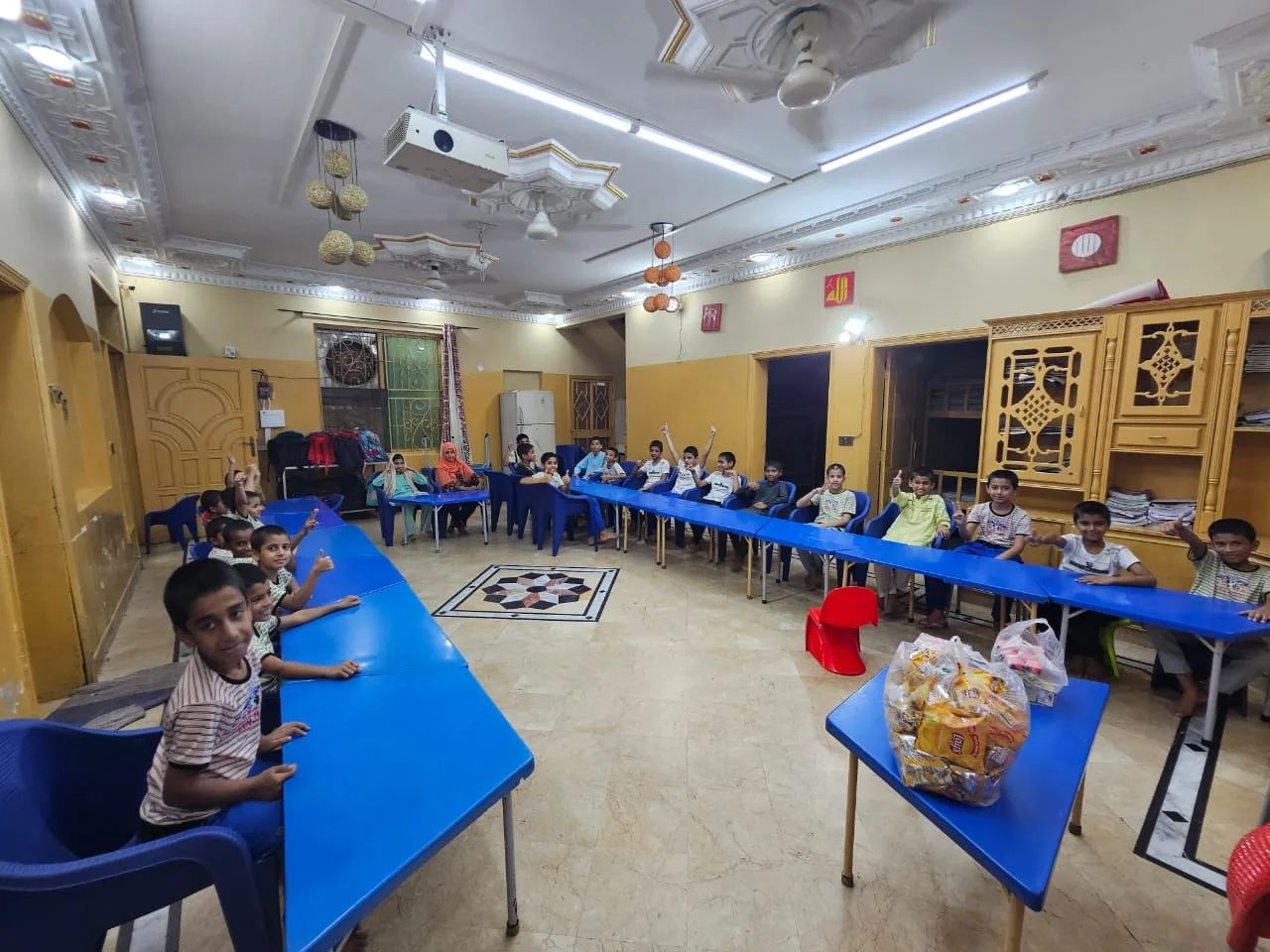 Children gathered in the common room at the Aasra Children's Home