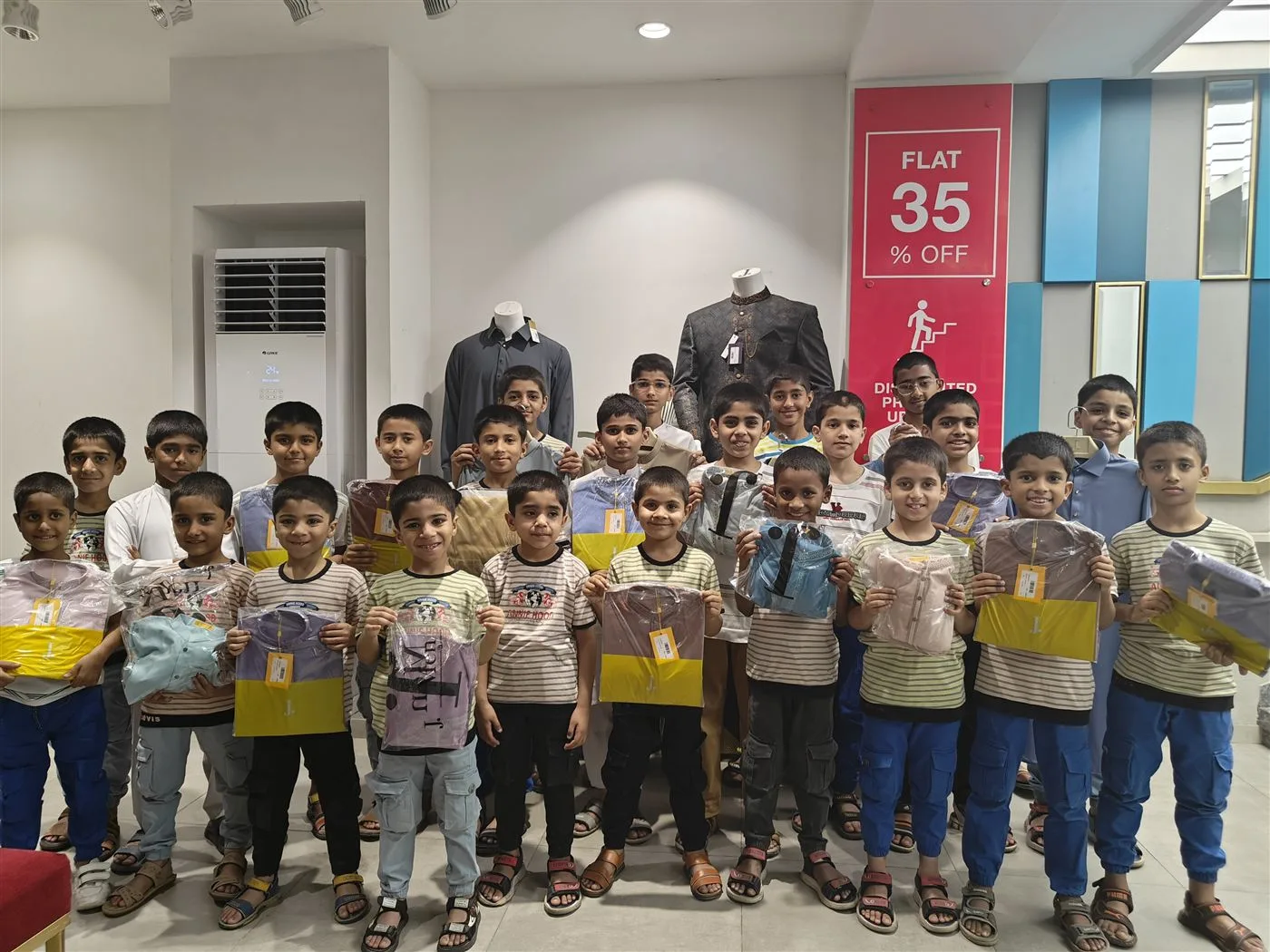 Children with new clothes on an Aasra shopping outing