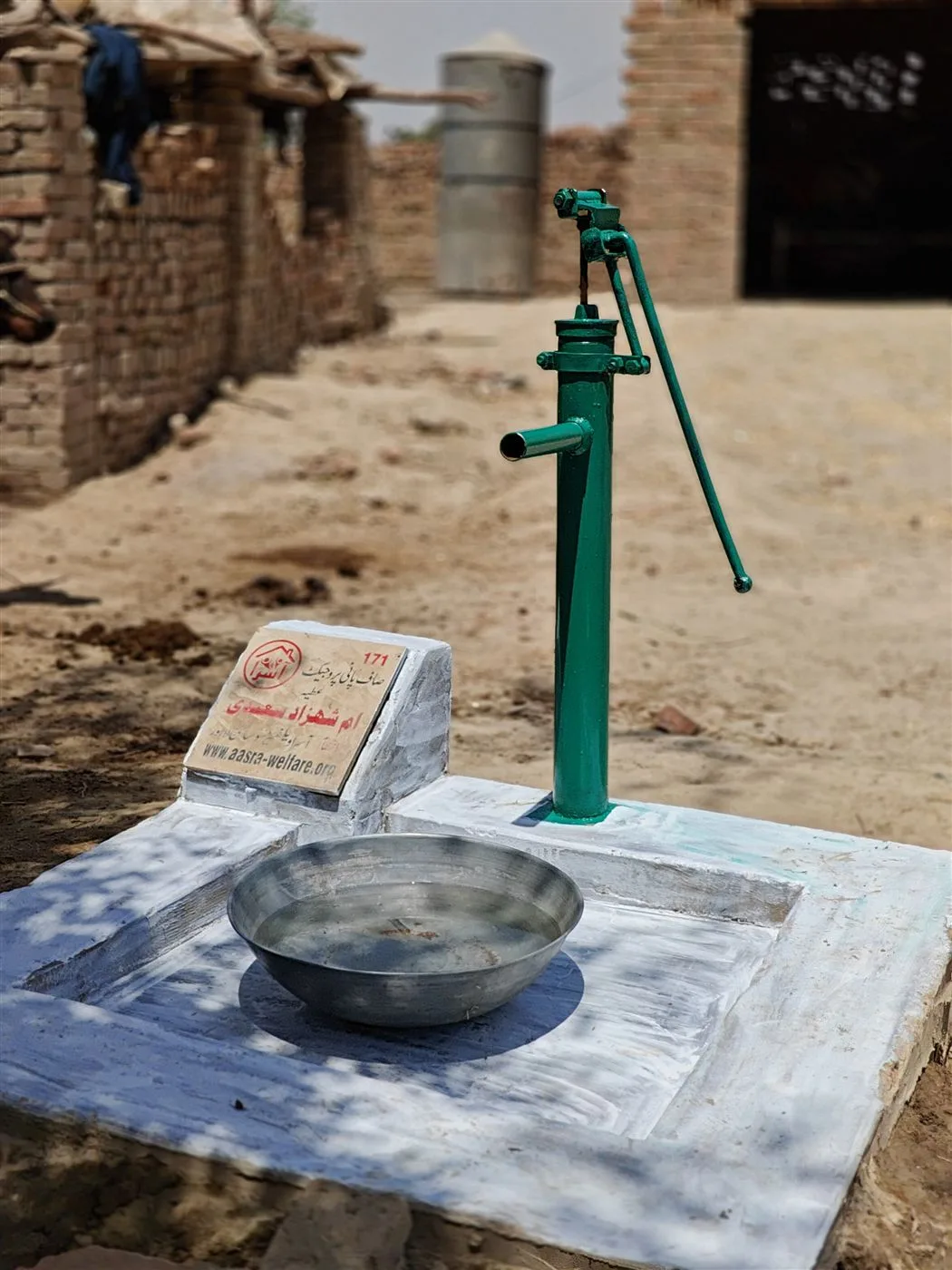 A newly installed hand pump providing clean water to a village